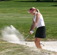 Krista Swanson hitting out of a bunker